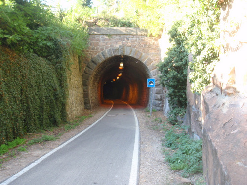 Old train tunnel and it is lighted.